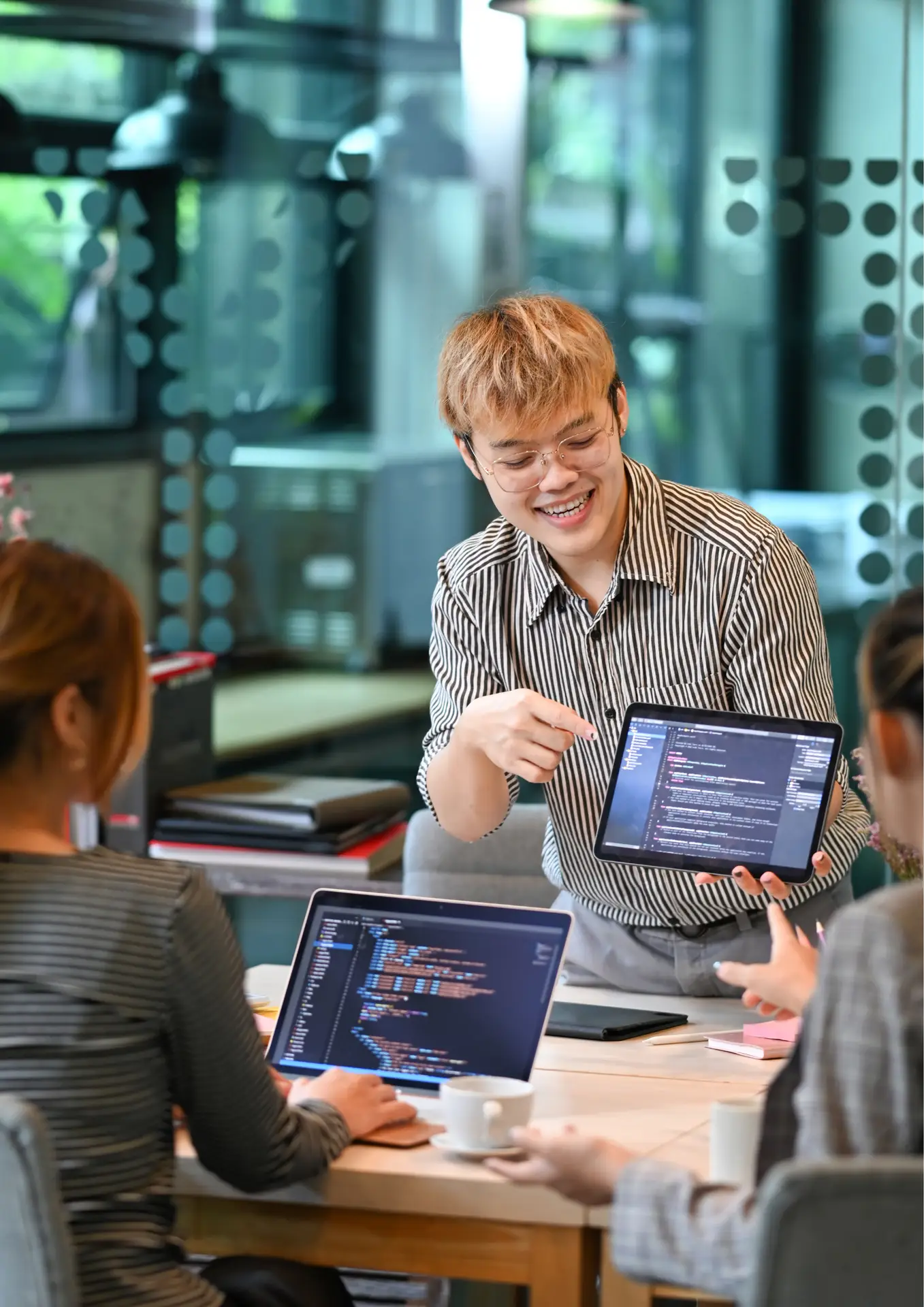 a man pointing at a tablet